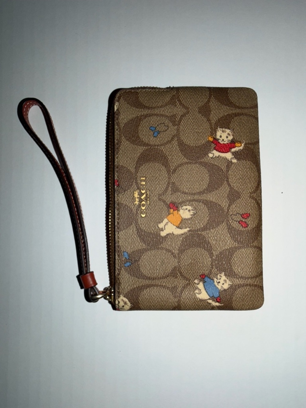 Coach Brown Signature Wristlet with Playful Puppy Motif